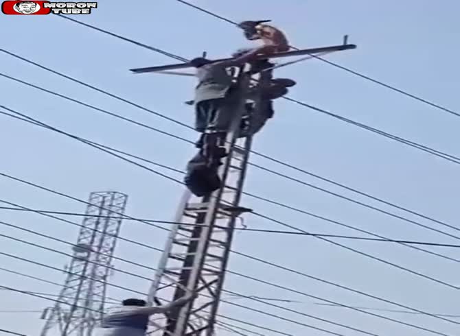 Video :To remove a guy from an electrical pylon, they beat him